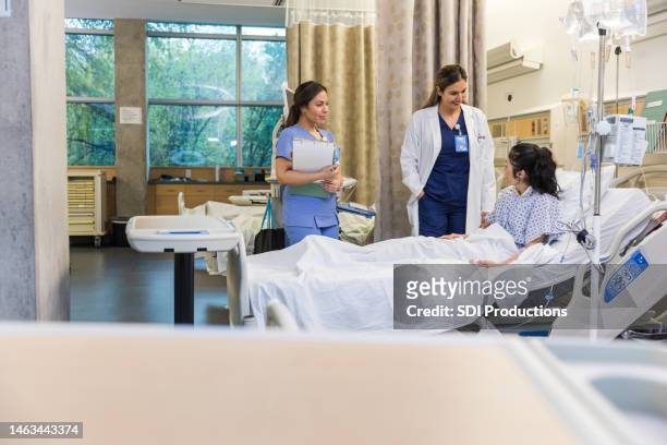 female patient sits up in bed - showing empathy stock pictures, royalty-free photos & images