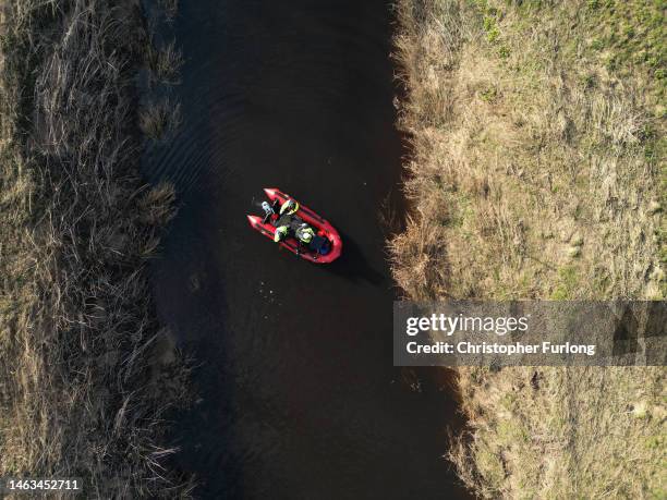 In this aerial view, search team members use sonar equipment onboard a RIB boat on February 6, 2023 in St Michael's on Wyre, England. An independent...