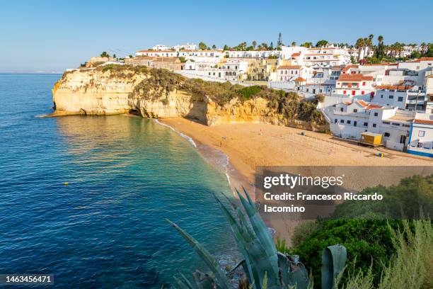 view over the beach and town of carvoeiro in the algarve, portugal - iacomino portugal stock-fotos und bilder