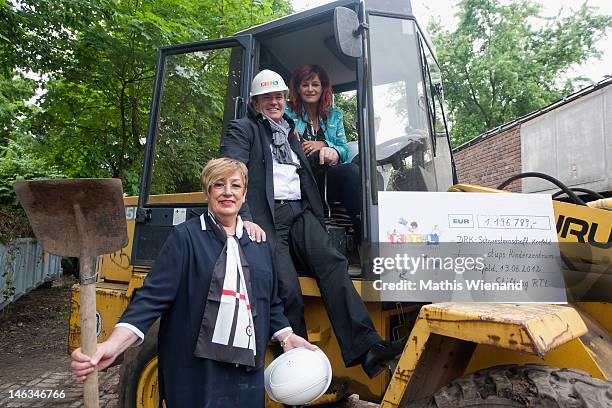 Andrea Berg , Wolfram Kons and Karin Meincke visit the Stups Children Center for the RTL Charity Marathon on June 13, 2012 in Krefeld, Germany.