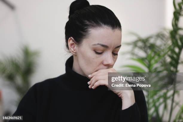 portrait adult single mother wearing black turtleneck feeling sad and tired at the city cafe - alpha female stock pictures, royalty-free photos & images