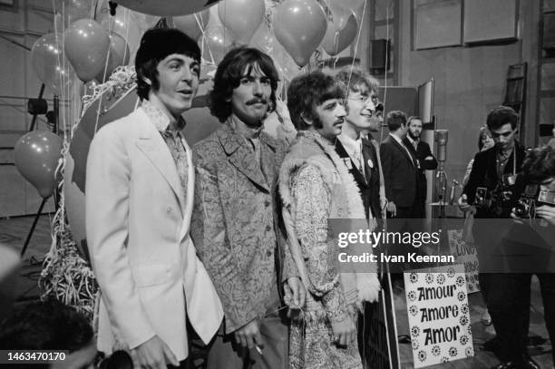 From left, Paul McCartney, George Harrison , Ringo Starr and John Lennon of English rock and pop group The Beatles pose together during a press call...