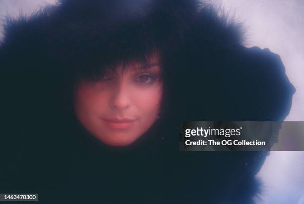 Portrait of American model and actress Sheila Kennedy in a black fur hat and matching jacket, New York, New York, September 1983. The photo was taken...