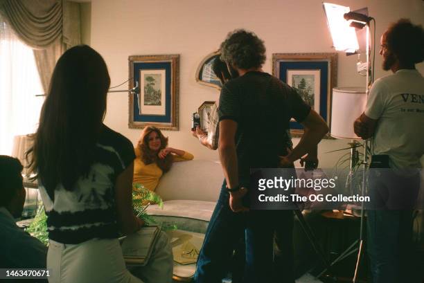 American model and actress Victoria Lynn Johnson takes with a crew during a photo session, July 1977. The session was for Penthouse magazine.