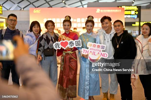 Travellers of a tour group pose at Nanning Wuxu International Airport on the way to Bangkok in Thailand on February 6, 2023 in Nanning, Guangxi...