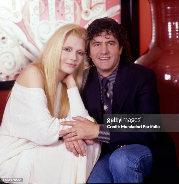 Italian singer Anna Oxa and Italian singer Fausto Leali pose for a photo shoot. Sanremo , 1989