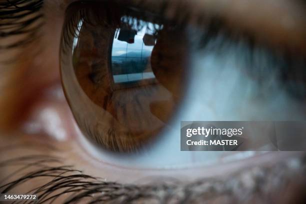 extreme close-up of human eye - iris mann stock-fotos und bilder