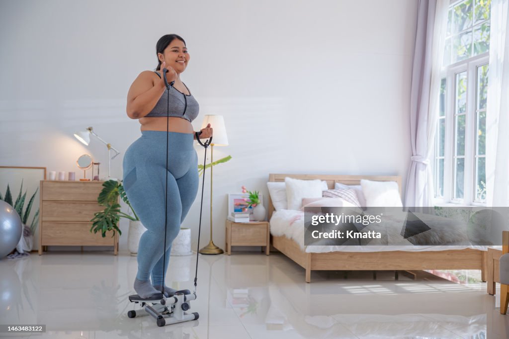 Plus Size Woman Doing Workout At Home High Res Stock Photo Getty Images plus-size-woman-doing-workout-at-home-high-res-stock-photo-getty-images