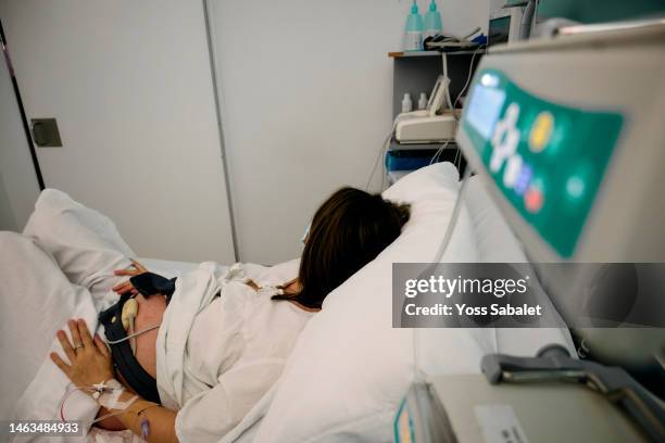 pregnant woman lying in a hospital bed - obstetric forceps stock pictures, royalty-free photos & images