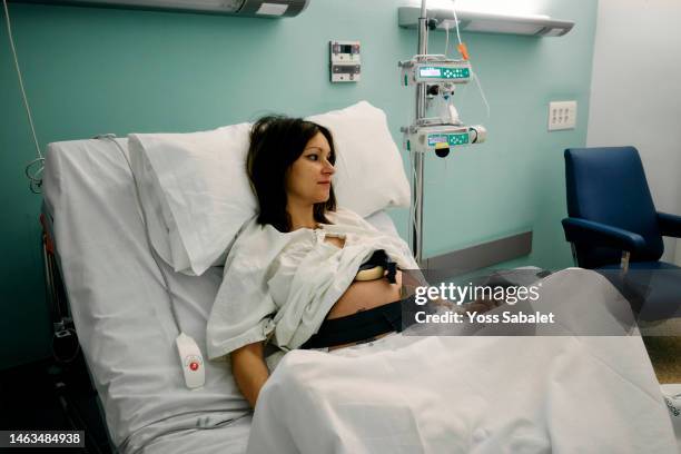 exhausted pregnant about to give birth - obstetric forceps stock pictures, royalty-free photos & images