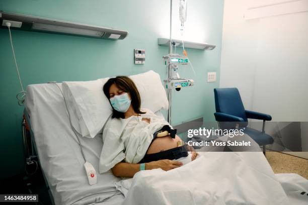 pregnant suffering with contractions before giving birth - obstetric forceps stock pictures, royalty-free photos & images