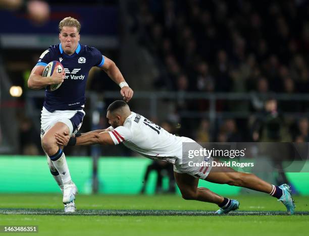 Duhan van der Merwe of Scotland goes past Joe Marchant to score his first and Scotland's second try during the Six Nations Rugby match between...