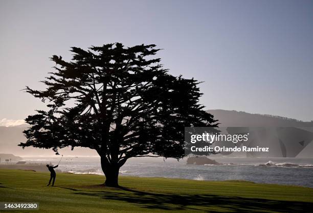 Denny McCarthy hits a second shot on the18th hole during the continuation of the final round of the AT&T Pebble Beach Pro-Am at Pebble Beach Golf...