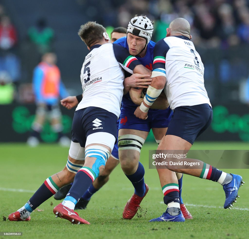Federico Ruzza Rugby Thibaud Flament of France is tackled by Federico Ruzza and Simone ...