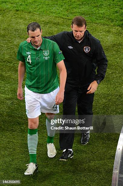 John O'Shea of Republic of Ireland is consoled by goal Alan Kelly during the UEFA EURO 2012 group C match between Spain and Ireland at The Municipal...