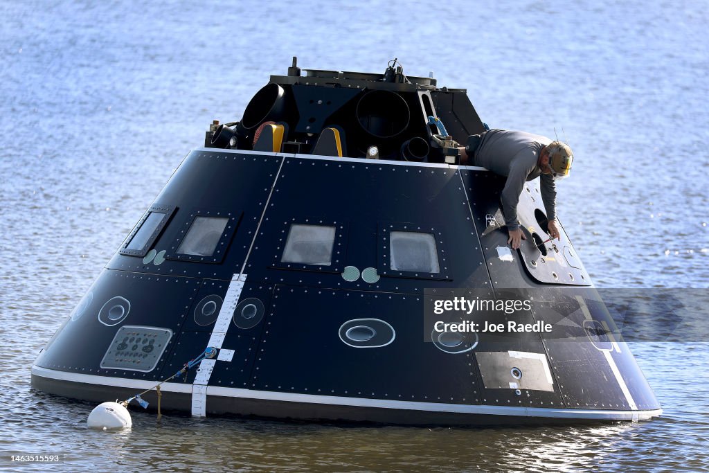 A Member Of The US Navy And NASA Landing And Recovery Team Practices a-member-of-the-us-navy-and-nasa-landing-and-recovery-team-practices