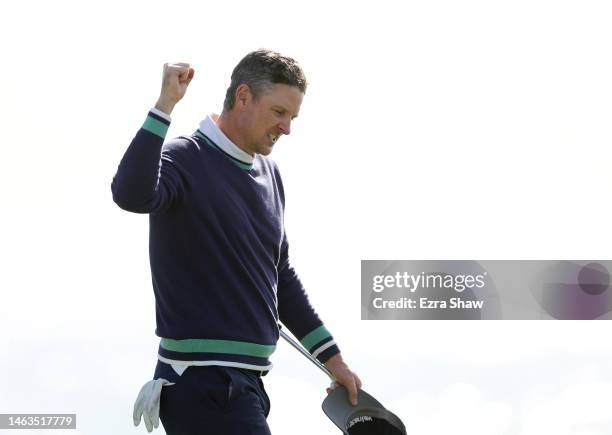 Justin Rose of England celebrates his final putt for victory on the 18th green during the continuation of the final round of the AT&T Pebble Beach...