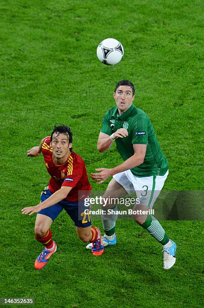 Stephen Ward of Republic of Ireland and David Silva of Spain during the UEFA EURO 2012 group C match between Spain and Ireland at The Municipal...