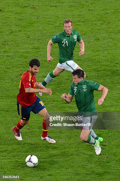 Sean St Ledger of Republic of Ireland closes down Cesc Fabregas of Spain during the UEFA EURO 2012 group C match between Spain and Ireland at The...