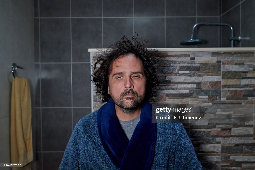 Man looking in the mirror in the morning