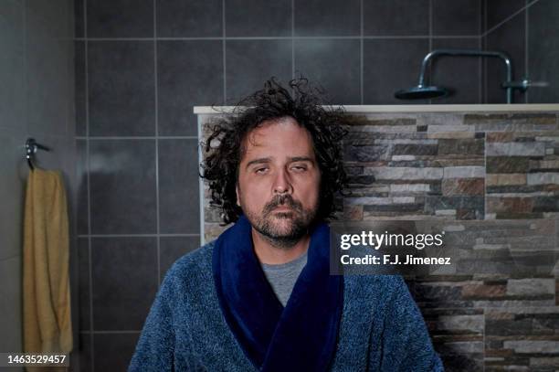 man looking in the mirror in the morning - bad hair day stock pictures, royalty-free photos & images