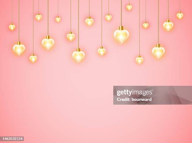 valentine's day background. heart glowing garland. - light bulb on string stock illustrations