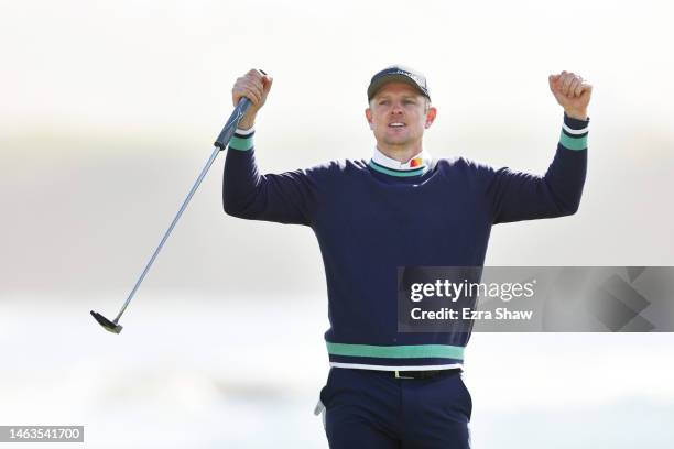 Justin Rose of England celebrates winning on the 18th green during the continuation of the final round of the AT&T Pebble Beach Pro-Am at Pebble...