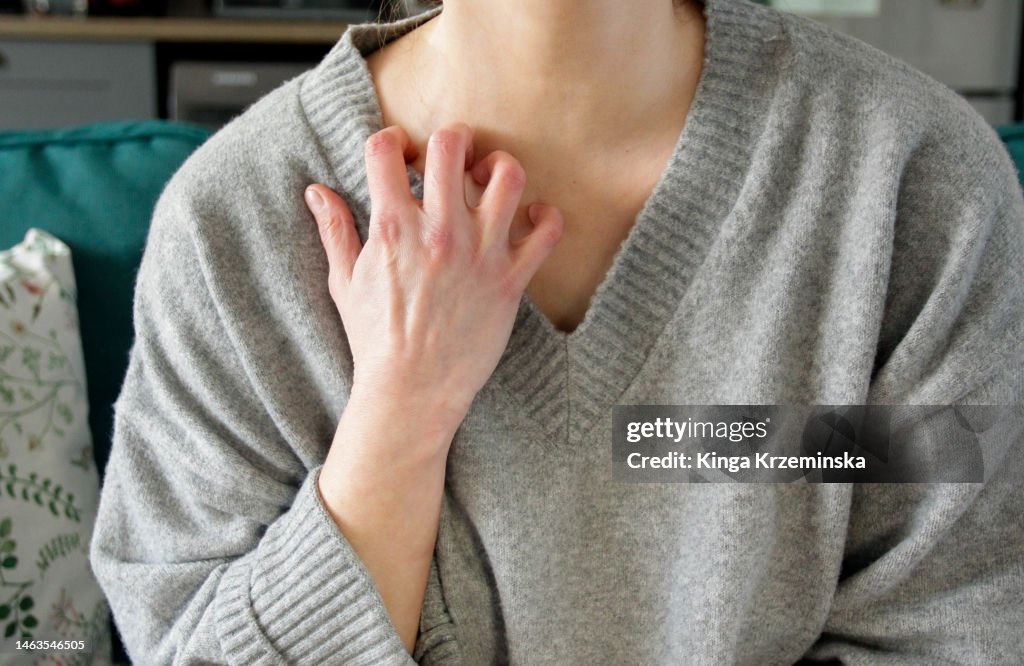 Scratching neck