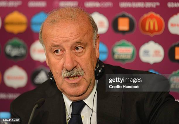 In this handout image provided by UEFA, Coach Vicente del Bosque of Spain talks to the media after the UEFA EURO 2012 Group C match between Spain and...