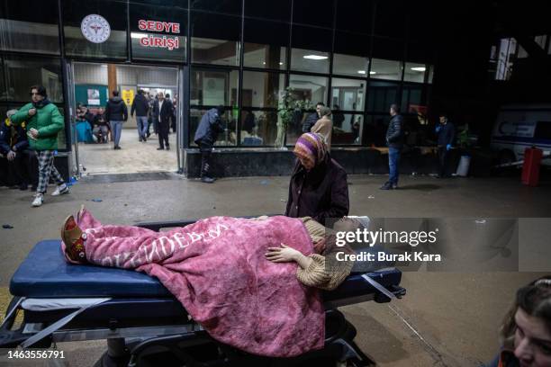 Wounded earthquake survivors wait to be treated at the entrance of a hospital on February 06, 2023 in Iskenderun Turkey. A 7.8-magnitude earthquake...