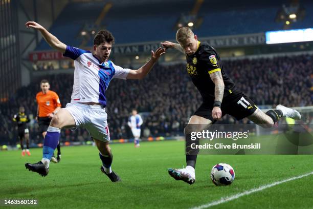 James McClean of Wigan attempts to cross the ball whilst under pressure from Joe Rankin-Costello of Blackburn Rovers during the Sky Bet Championship...