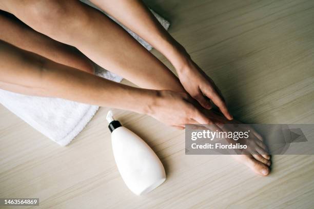 White Plastic Bottle With A Dispenser In The Hands Of A Woman High-Res Stock Photo