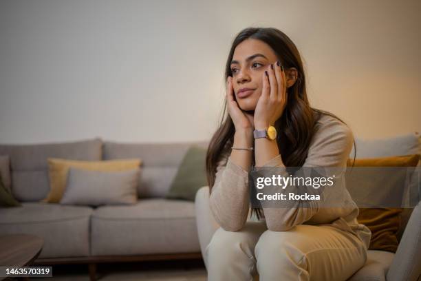 unhappy young woman - pessimisme stock pictures, royalty-free photos & images