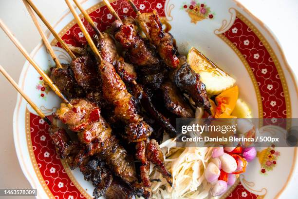 sate kambing or sate klatak or lamb satay or goat meat satay served with served with sliced cabbag,giurgiu,romania - satay stock pictures, royalty-free photos & images
