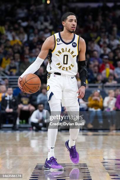 Tyrese Haliburton of the Indiana Pacers dribbles the ball in the third quarter against the Cleveland Cavaliers at Gainbridge Fieldhouse on February...