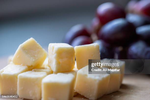 cheese and grape platter - cheese platter stock-fotos und bilder