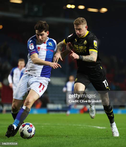 James McClean of Wigan Athletic and Joe Rankin-Costello of Blackburn Rovers battle for the ball during the Sky Bet Championship between Blackburn...