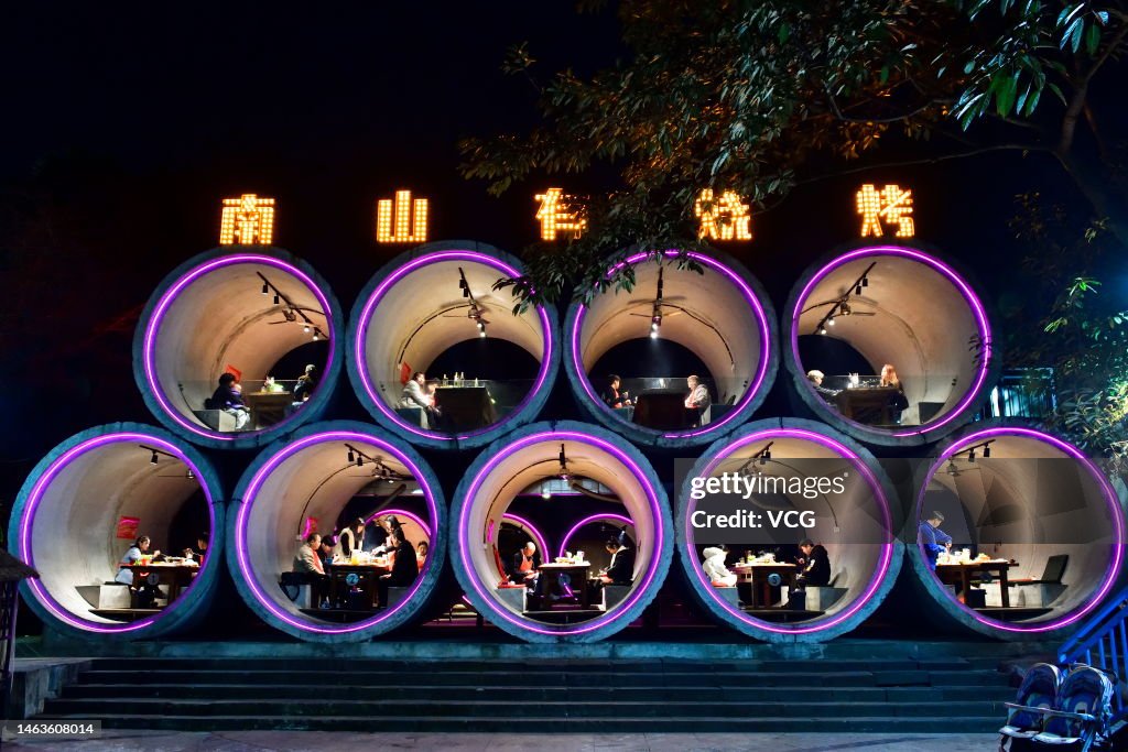 A Restaurant Featuring Cement Pipes Being Popular In Chongqing