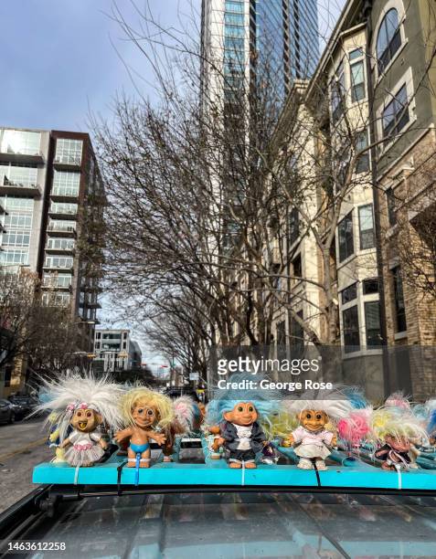 Troll dolls are strapped to the top of a car as viewed on January 17 in Austin, Texas. Austin, the State Capitol of Texas, is the state's second...