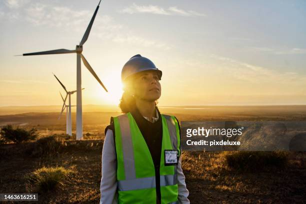 renewable energy, windmill and engineer woman on farm for sustainability, power and electricity. technician person in nature for wind turbine and green environment innovation maintenance at sunset - african american women in the wind stock pictures, royalty-free photos & images
