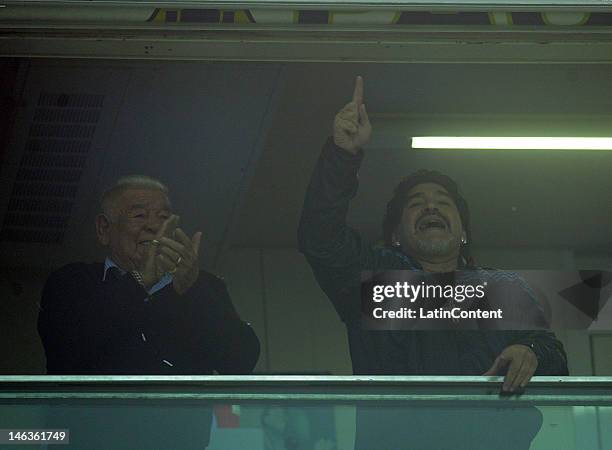 Diego Maradona with his father cheer for Boca during the first leg of the Copa Libertadores 2012 semi-finals between Boca Jrs and Universidad de...