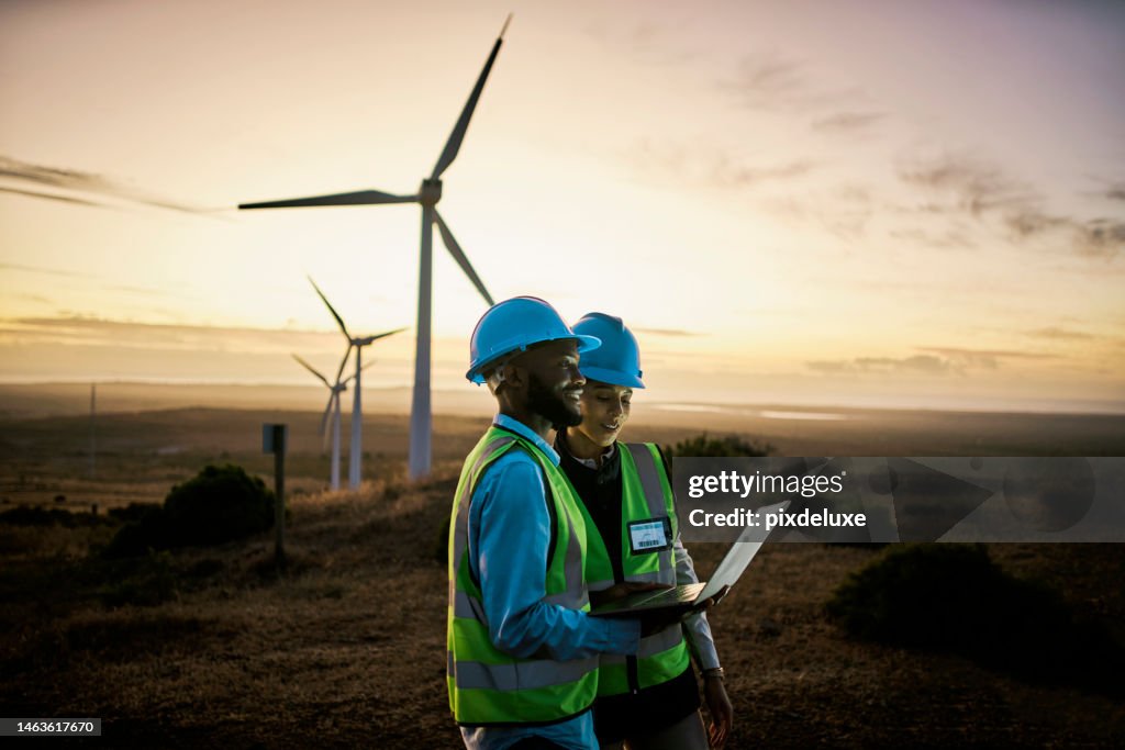 Laptop, farm and engineer team together at night for renewable energy, power and wind turbine. Electrician or technician man and woman in nature for electricity, eco and green environment maintenance