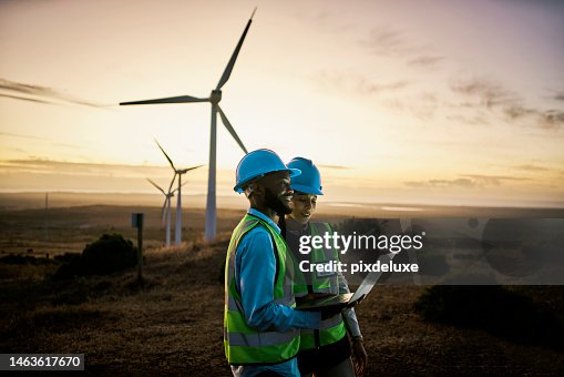 Laptop, farm and engineer team together at night for renewable energy, power and wind turbine. Electrician or technician man and woman in nature for electricity, eco and green environment maintenance Laptop, farm and engineer team together at night for renewable energy, power and wind turbine. Electrician or technician man and woman in nature for electricity, eco and green environment maintenance