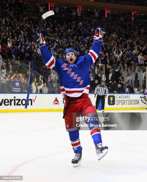 Alexis Lafreniere of the New York Rangers celebrates his game-winning overtime goal against the Calgary Flames at Madison Square Garden on February...