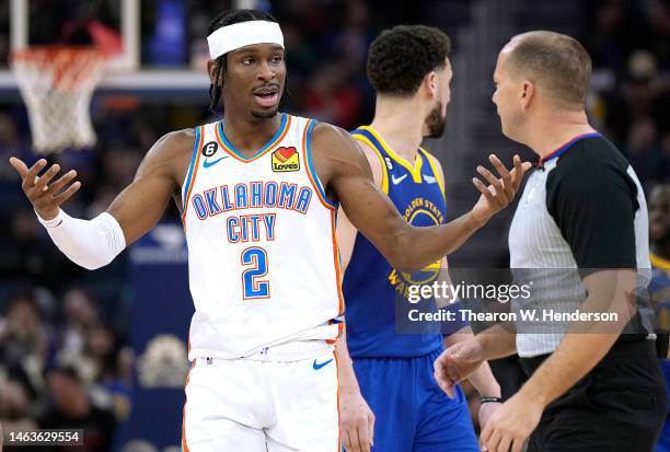 Shai Gilgeous-Alexander of the Oklahoma City Thunder complains to official John Goble after Goble called a foul on Gilgeous-Alexander against the...