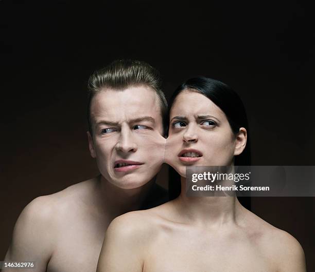 young pair glued together - couple trapped stock pictures, royalty-free photos & images