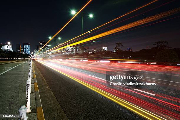 traffic trails of tokyo - tail light stock pictures, royalty-free photos & images