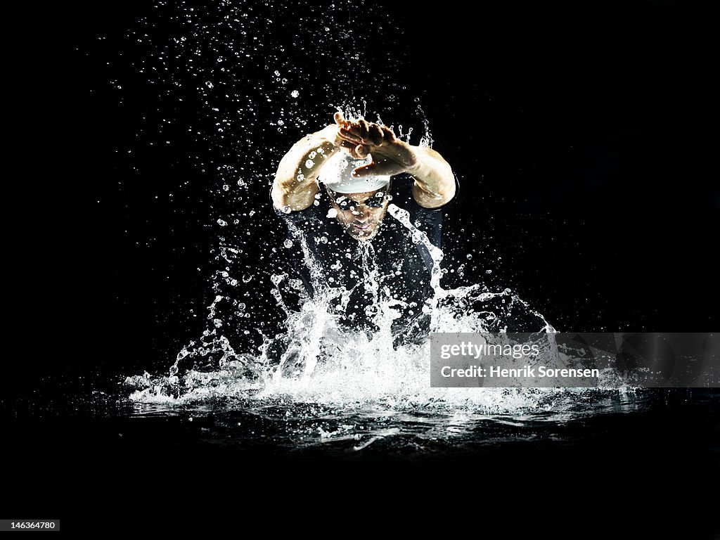 Male swimmer performing