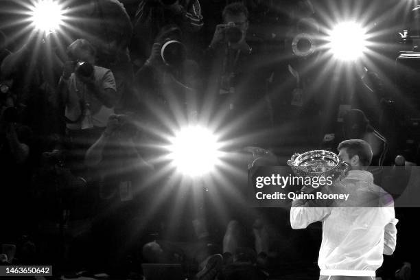 Novak Djokovic of Serbia poses with the Norman Brookes Challenge Cup after winning the Men's Singles Final match against Stefanos Tsitsipas of Greece...