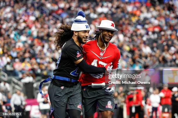 Strong safety Talanoa Hufanga of the San Francisco 49ers and AFC wide receiver Davante Adams of the Las Vegas Raiders share a moment during an NFL...